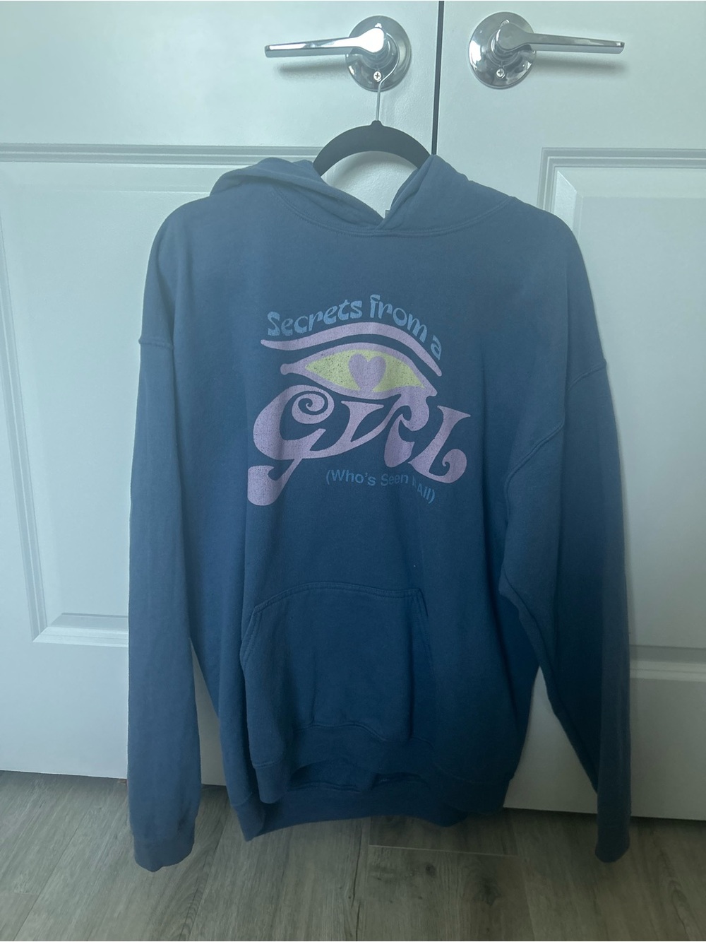 Blue Graphic Hoodie with 'Secrets From a Girl' Eye Design